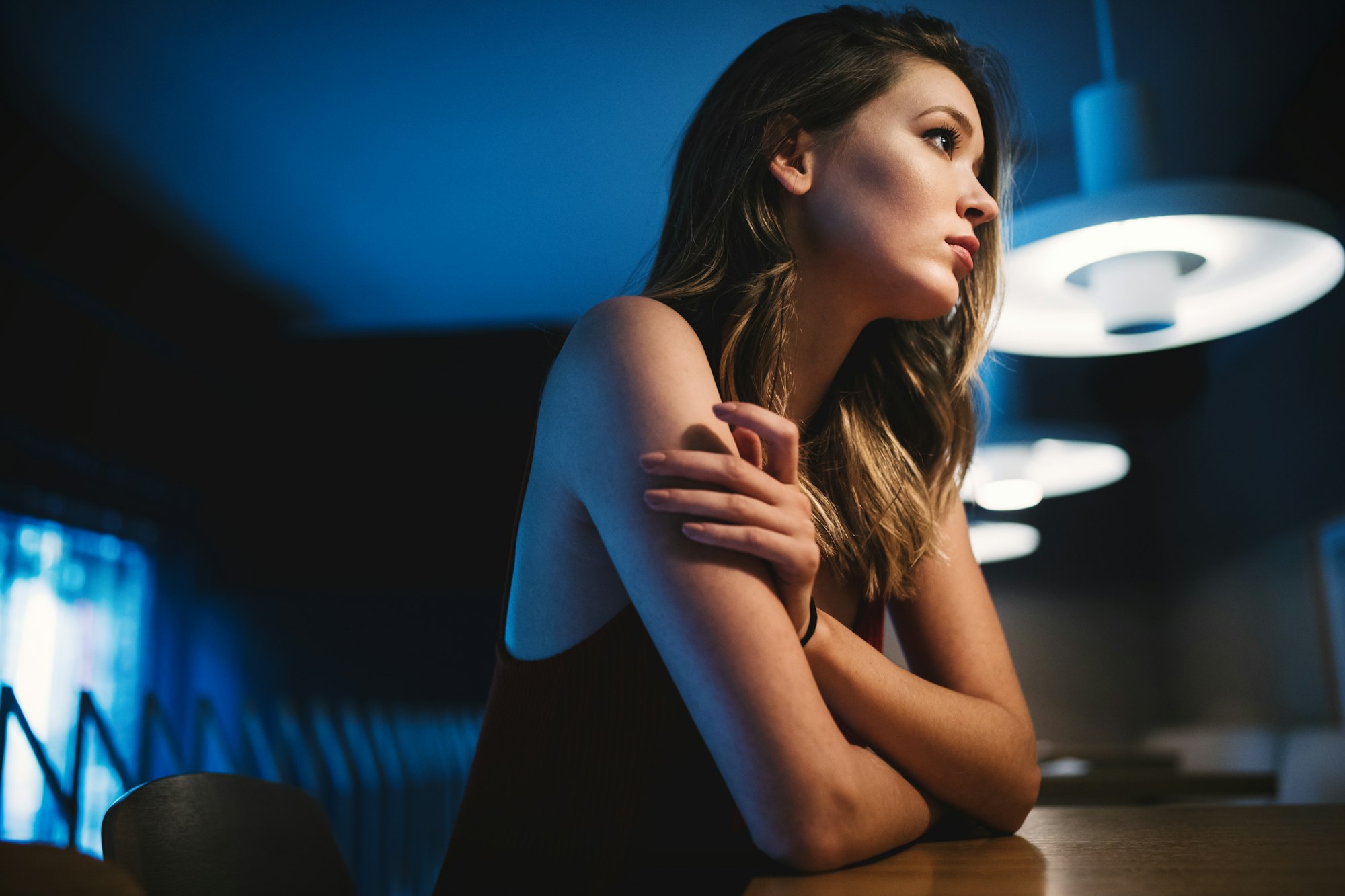 Portrait of clever young woman thinking alone