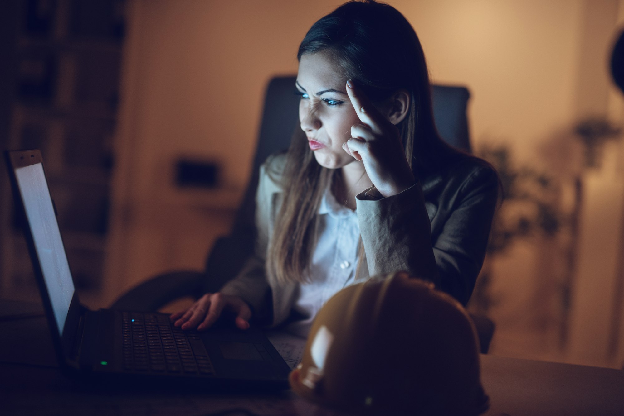 Woman Using A Laptop Late At Night